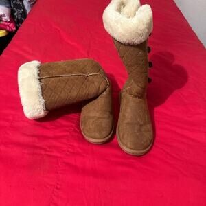 Brown and white ugg boots